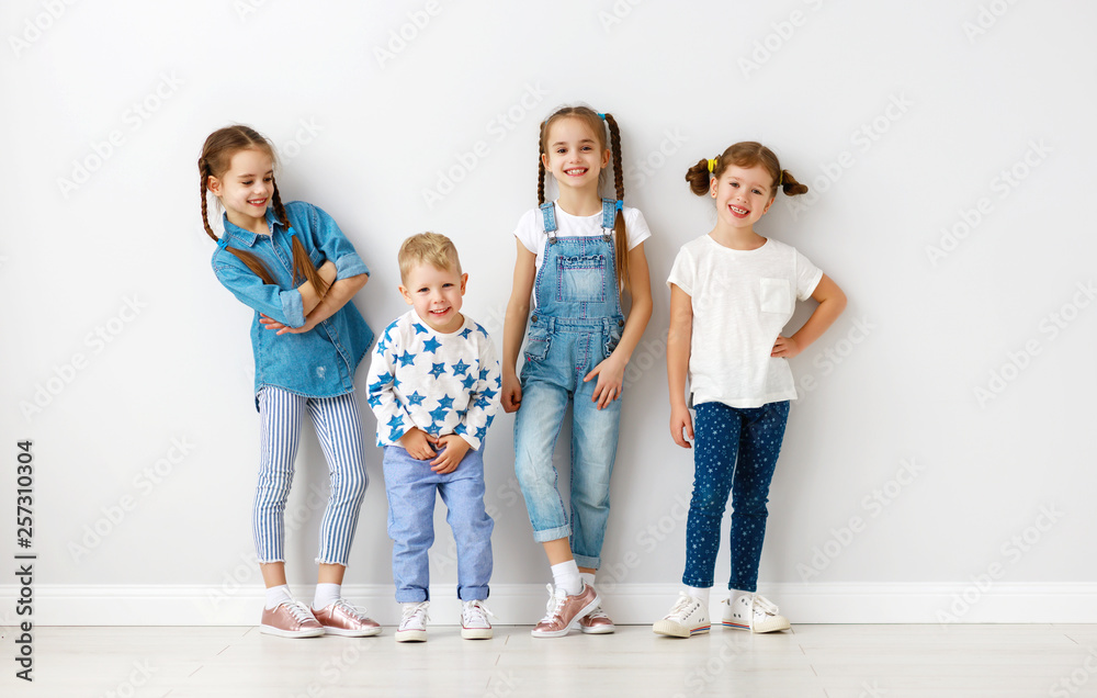 happy kids friends around empty walls.