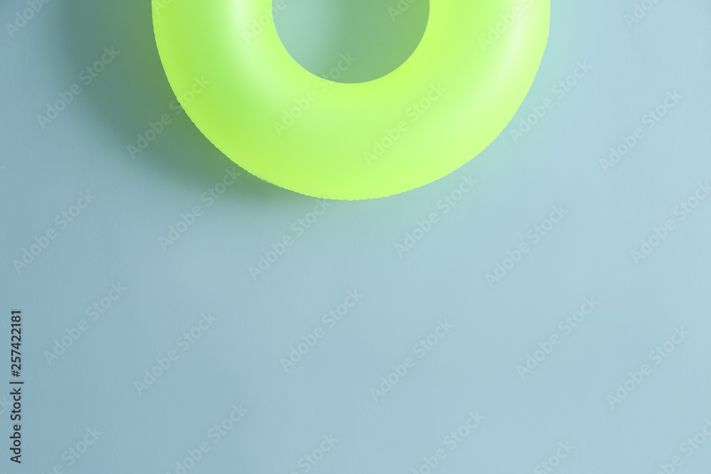 Inflatable ring on color background