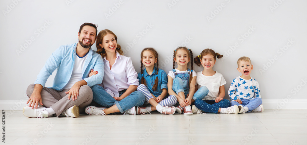 large family mother father and children sons and daughters on white background.