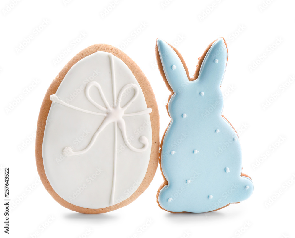 Tasty Easter cookies on white background