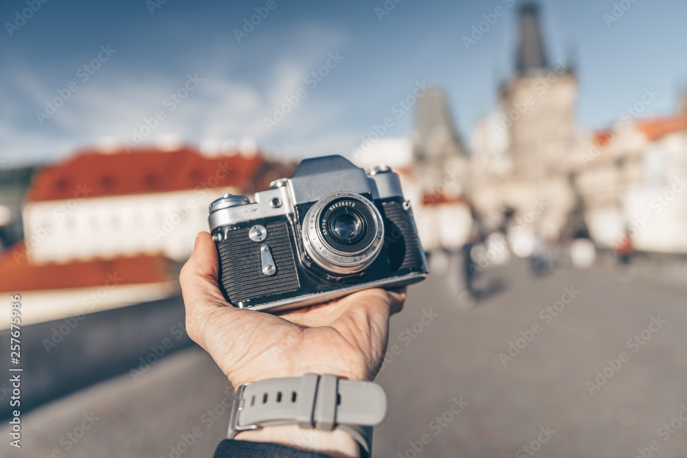 Male hand with a camera in Europe