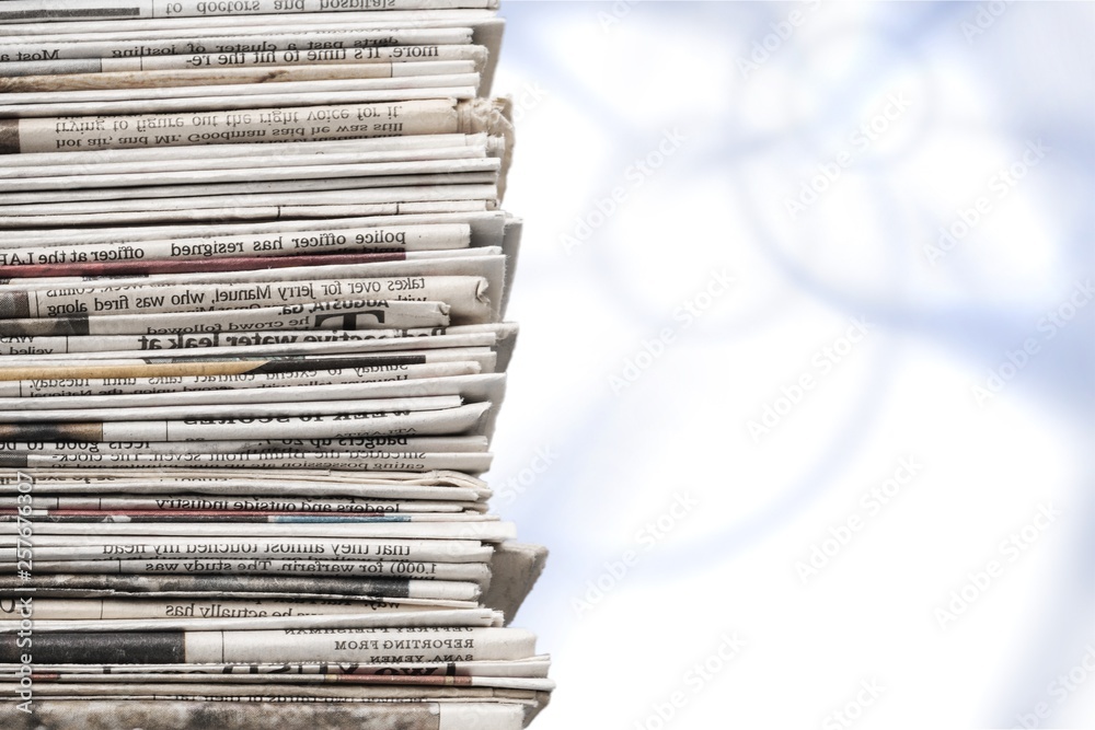 Pile of newspapers on background