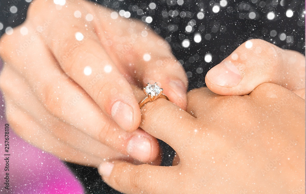 Close up Groom Putting the Wedding Ring on bride