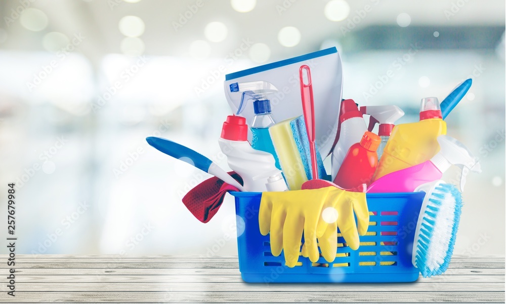 Plastic bottles, cleaning sponge and gloves  on background