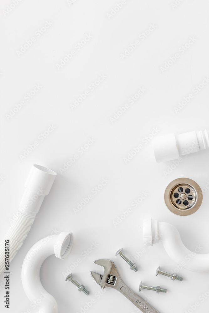 Plumber profession with gear and instruments for repair tubes on white background top view copyspace