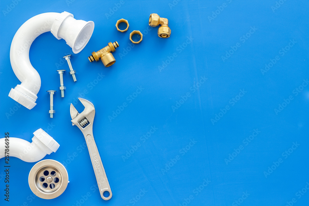 Plumber work with instruments, tools and gear on blue background top view mock up