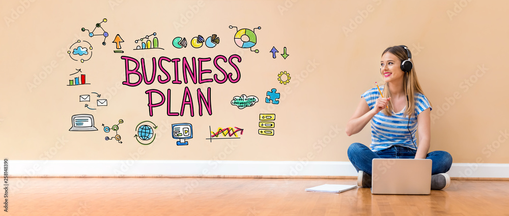 Business plan with young woman with headphones using a laptop computer and a pencil