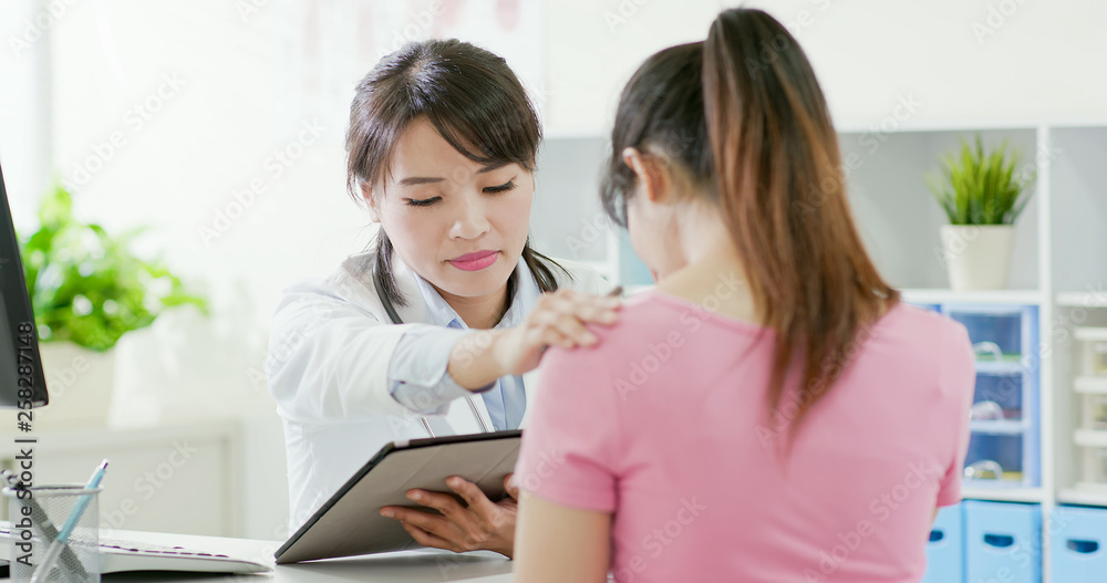 female doctor console patient