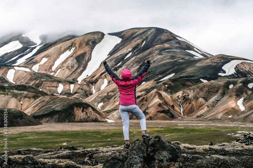 Traveler hiking at Landmannalaugar surreal nature landscape in highland of Iceland, Nordic, Europe. 