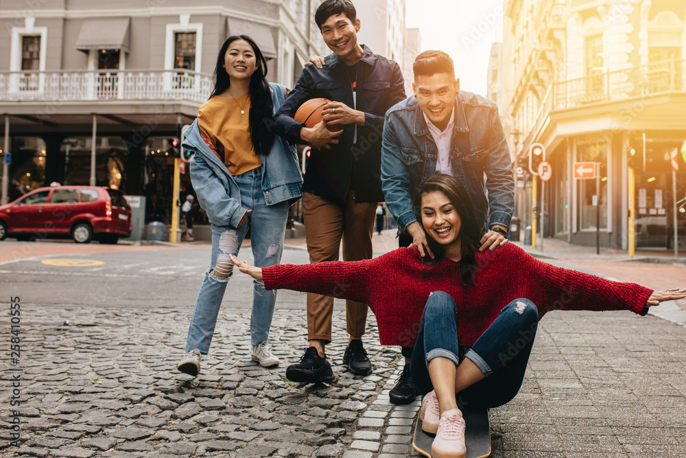 Asian friends having great time on the city