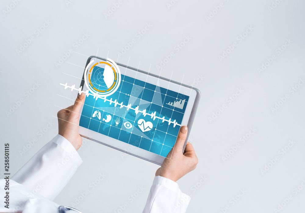 Close of female doctor hands working with tablet pc computer