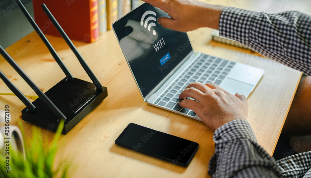 Young man Connecting router wifi On smartphone  for Internet and social media