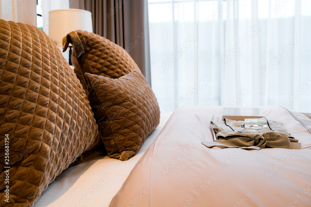 Bed maid-up with clean white pillows and bed sheets in beauty bedroom. Close-up. interior background