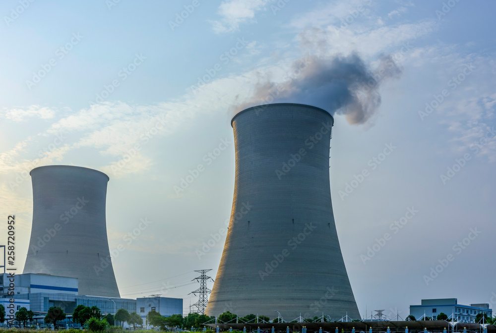 At dusk, the thermal power plants , tops of cooling towers of atomic power plant