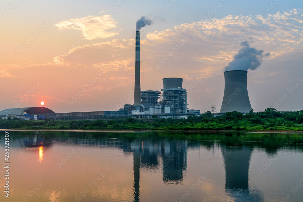 At dusk, the thermal power plants , tops of cooling towers of atomic power plant