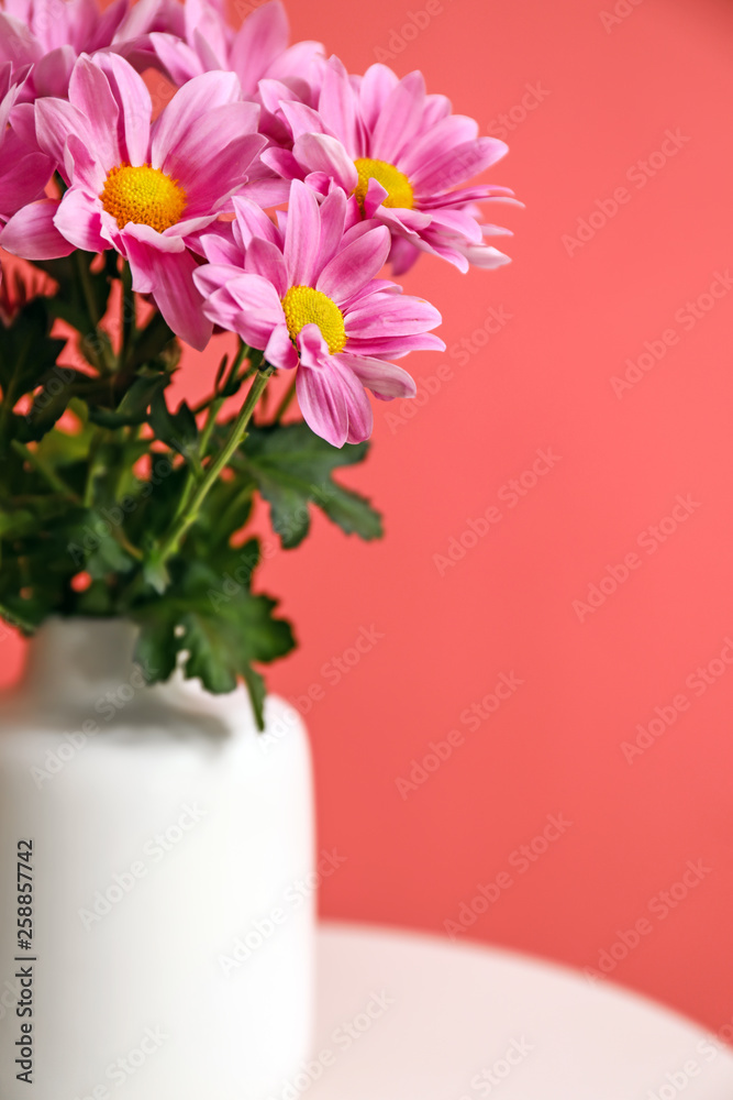 Vase with beautiful flowers on table, closeup