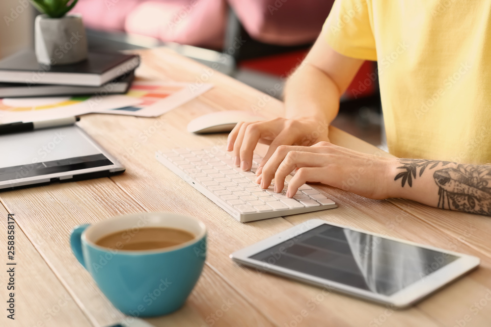 Female designer working in office, closeup