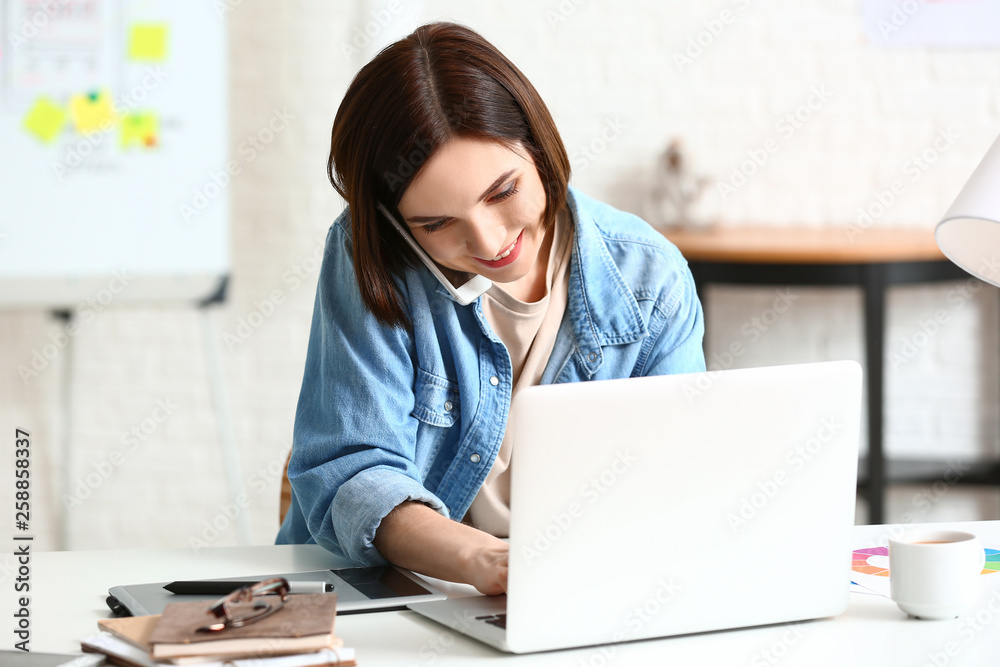 Female designer working in office