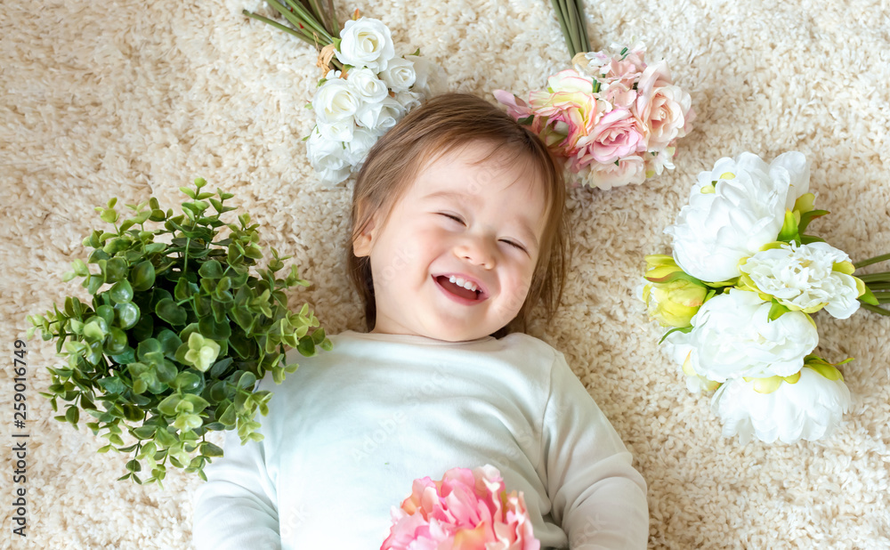 Toddler boy with a bouquet of pretty flowers