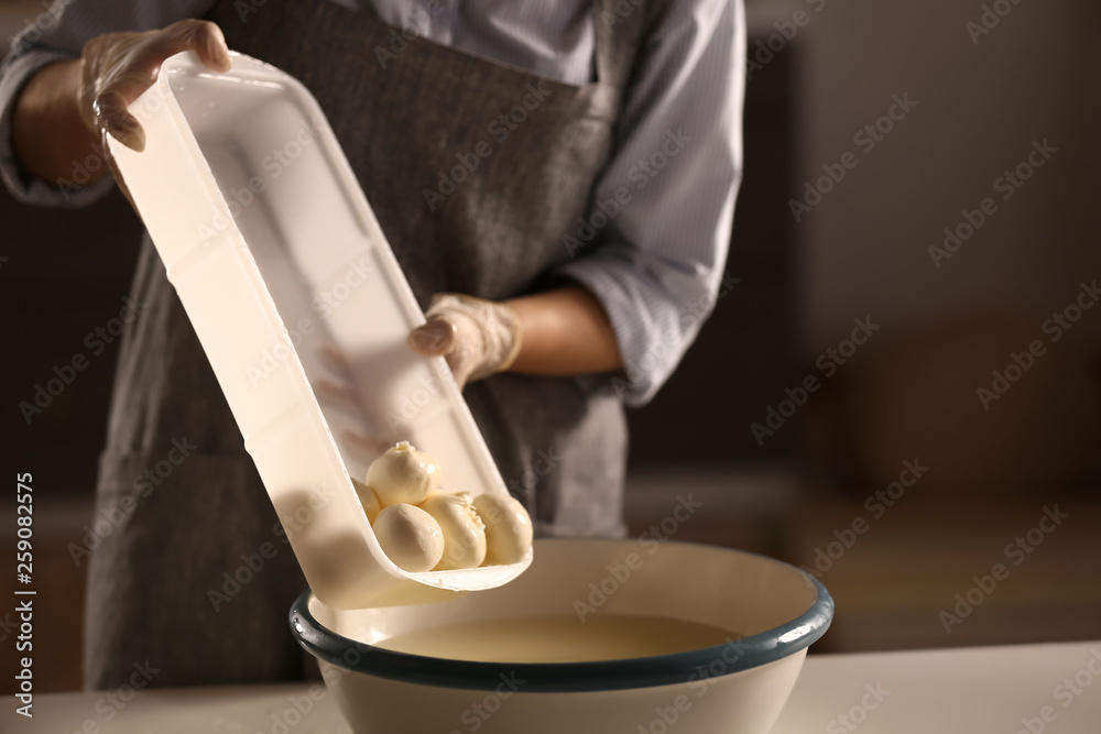 Woman preparing tasty cheese