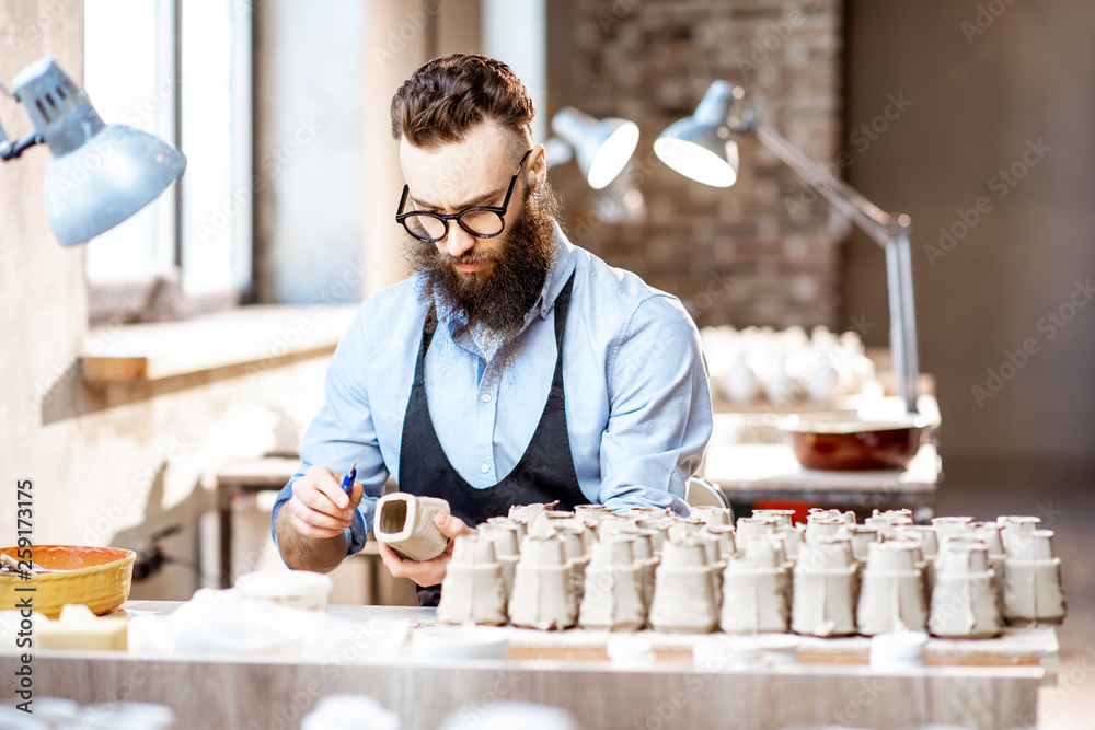 Man working with ceramics at the pottery