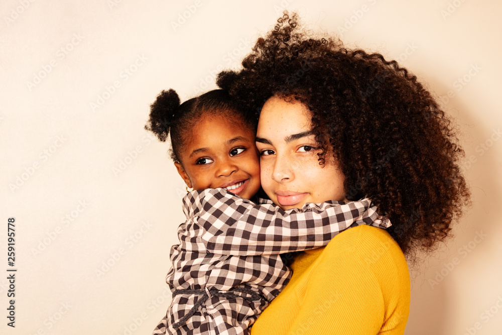 Close portrait of woman with little black girl