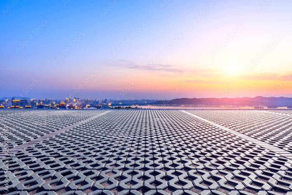 Empty square floor and beautiful city scenery with mountain in Hangzhou