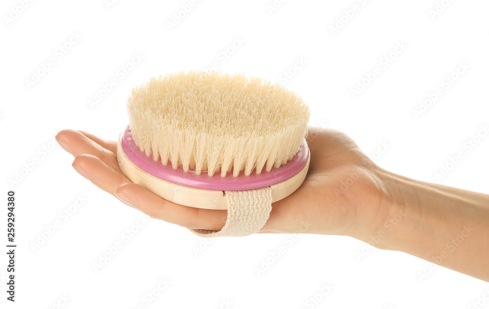 Female hand with massage brush on white background