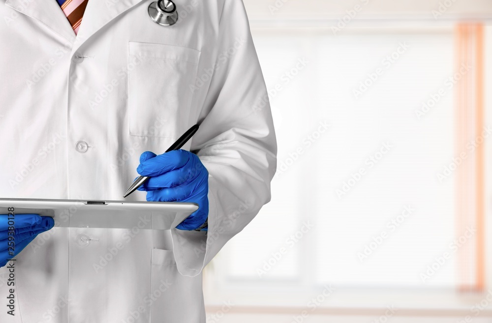 Close-up Doctor at hospital working with tablet pc