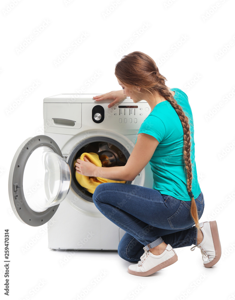 Young woman doing laundry on white background