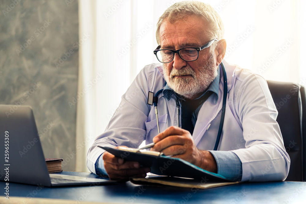 Doctor working in hospital office. Medical healthcare concept.