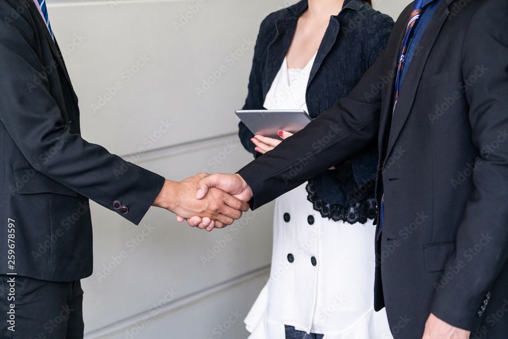 Business people agreement concept. Businessman do handshake with another businessman in the office m