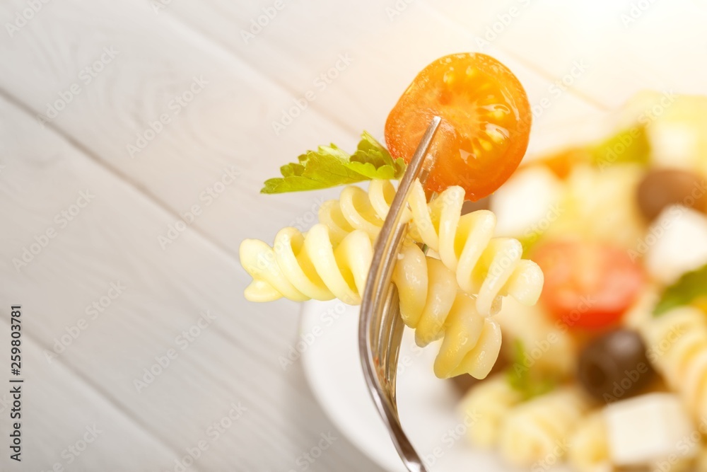 Delicious pasta on white plate on  background