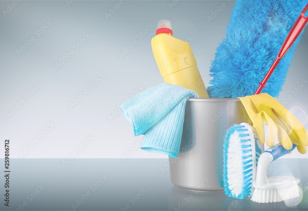 Plastic bottle, cleaning sponge and gloves  on background