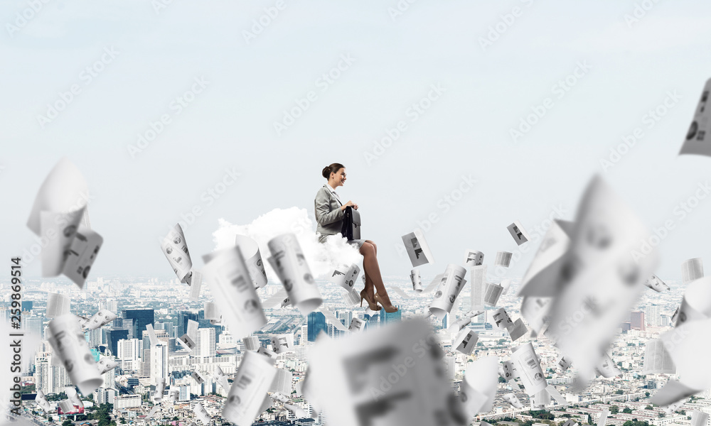 Woman float above city on cloud and papers flying around