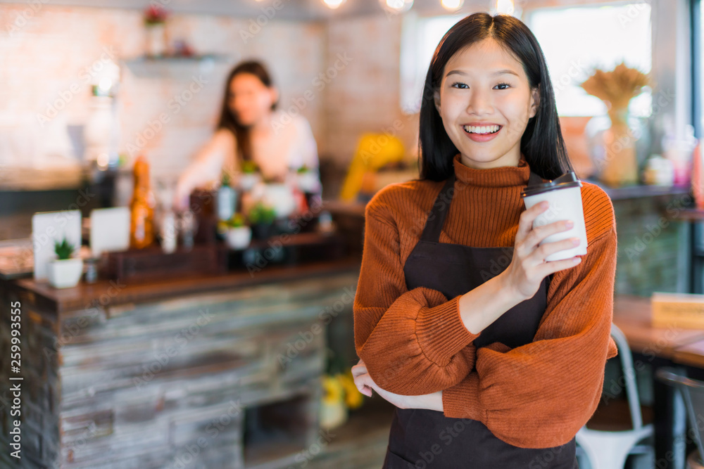 beautiful attractive asian cafe shop owner smile with happiness and joyful with coffee cup apron caf