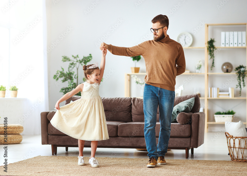 Happy fathers day! family dad and child daughter Princess dancing.