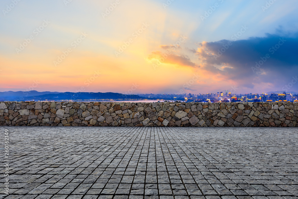 Empty square floor and beautiful city scenery with mountain in Hangzhou