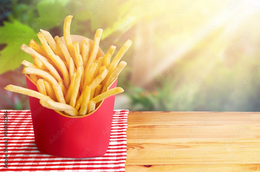 French fries in a red carton box isolated on white