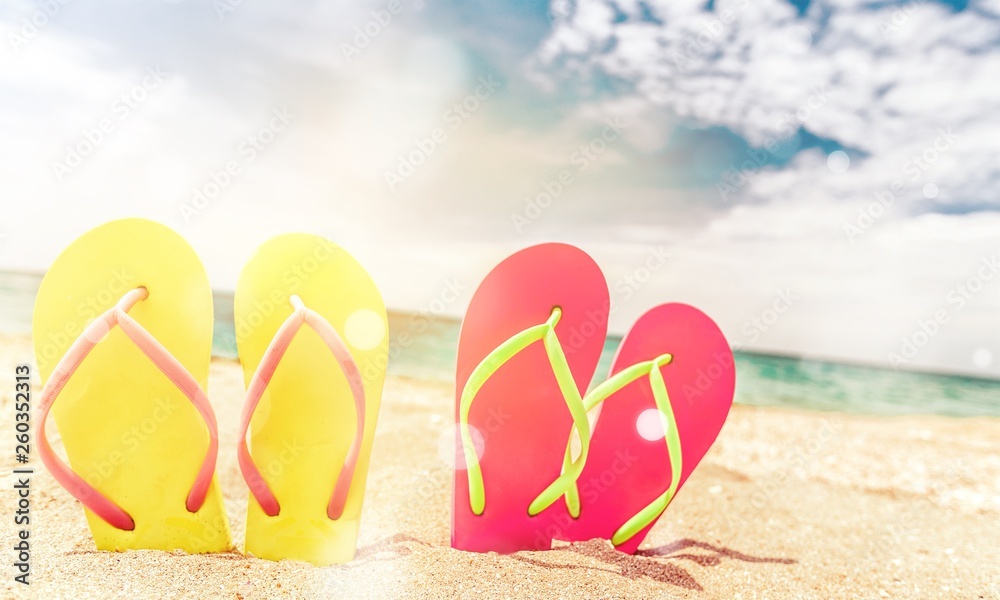 Pairs Of Flip-flops On Beach, vacation concept