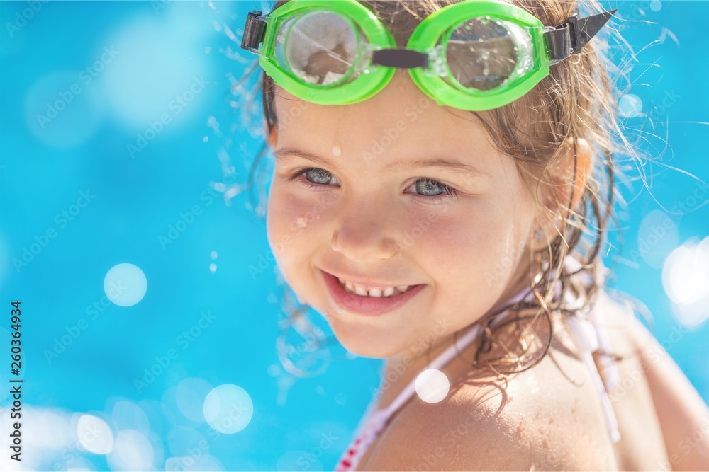 Beautiful little girl sunning at the pool