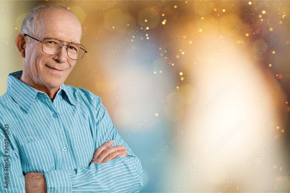 Happy senior man in blue shirt