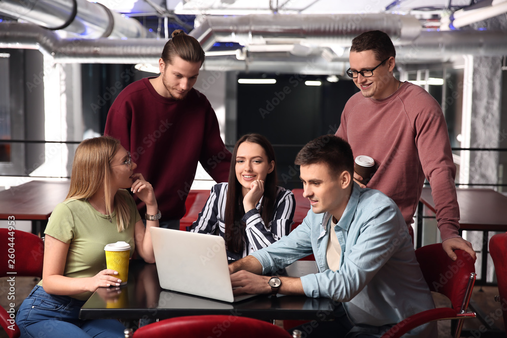 Young colleagues during coffee break in cafe