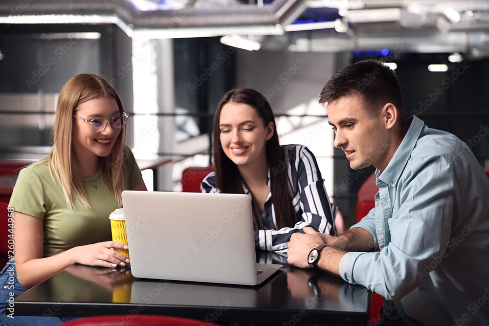 Young colleagues during coffee break in cafe