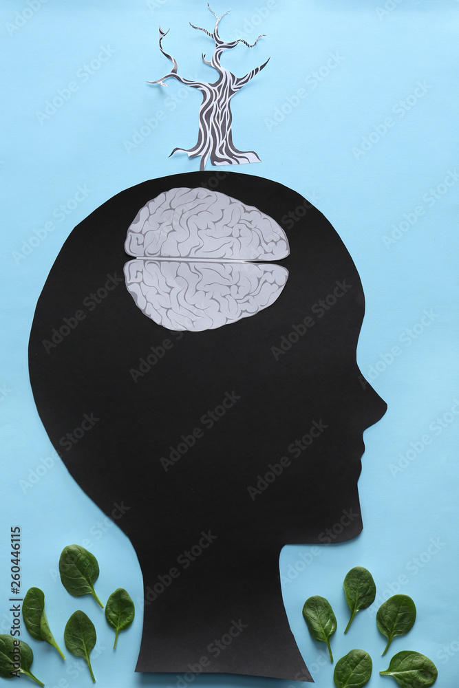 Creative composition with human head and brains on color background. Concept of healthy brain