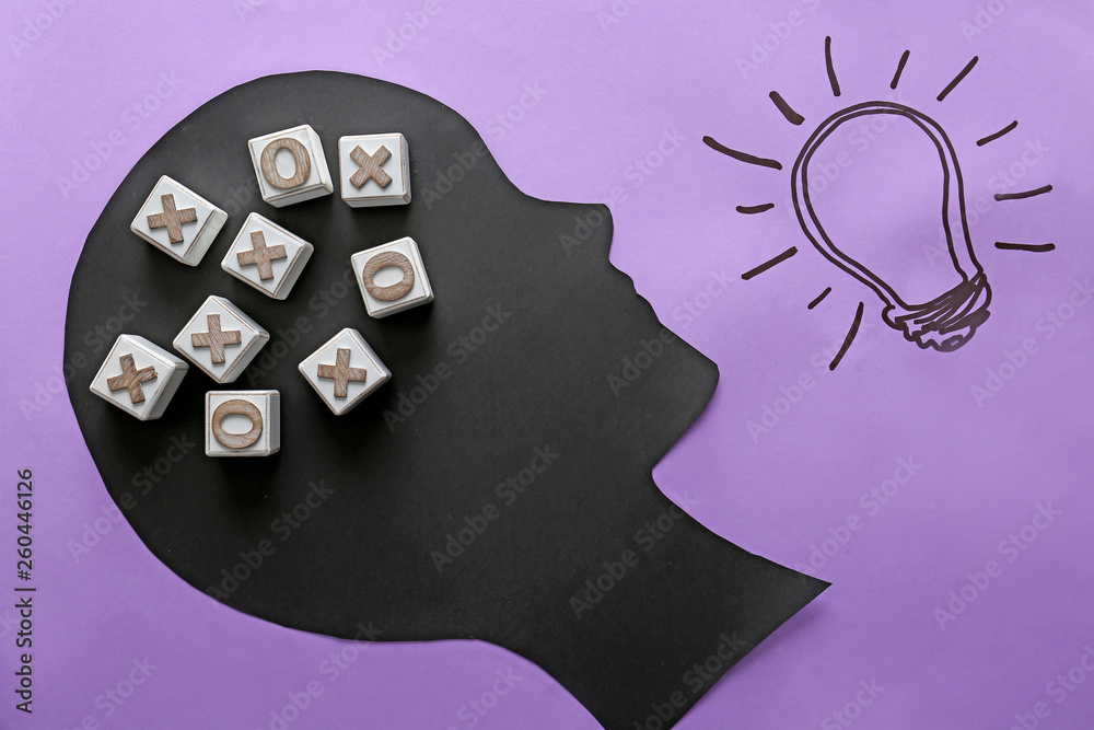 Human head with cubes and lightbulb on color background