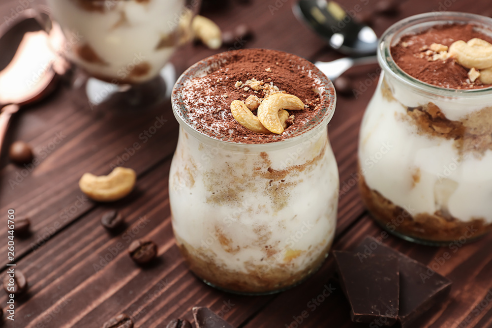 Tasty tiramisu on wooden table