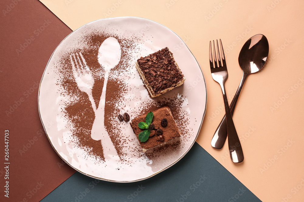 Plate with tasty tiramisu on color background