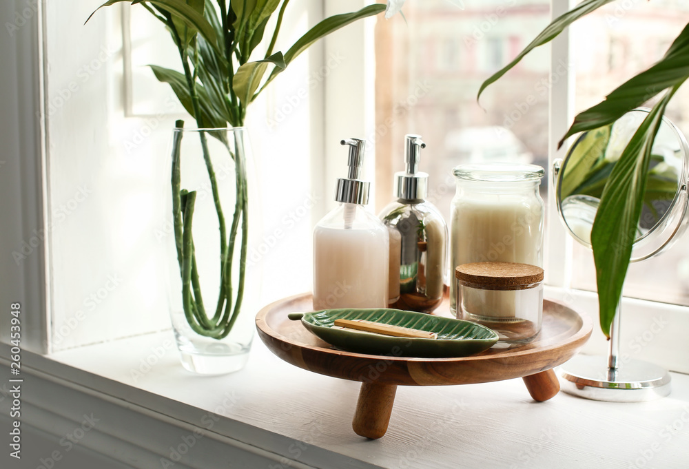 Set of professional cosmetic products on windowsill at home