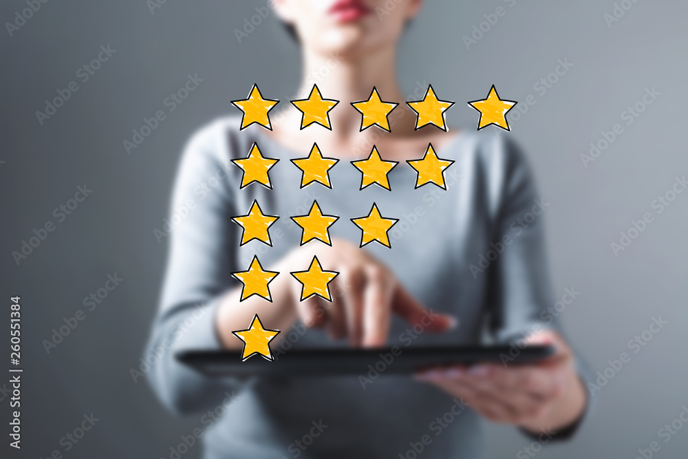 Rating theme with business woman using a tablet computer